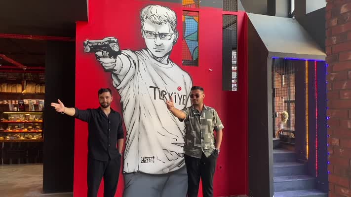 Yusuf Dikeç’in olimpiyatlardaki atış tarzı işletme duvarına resmedildi
